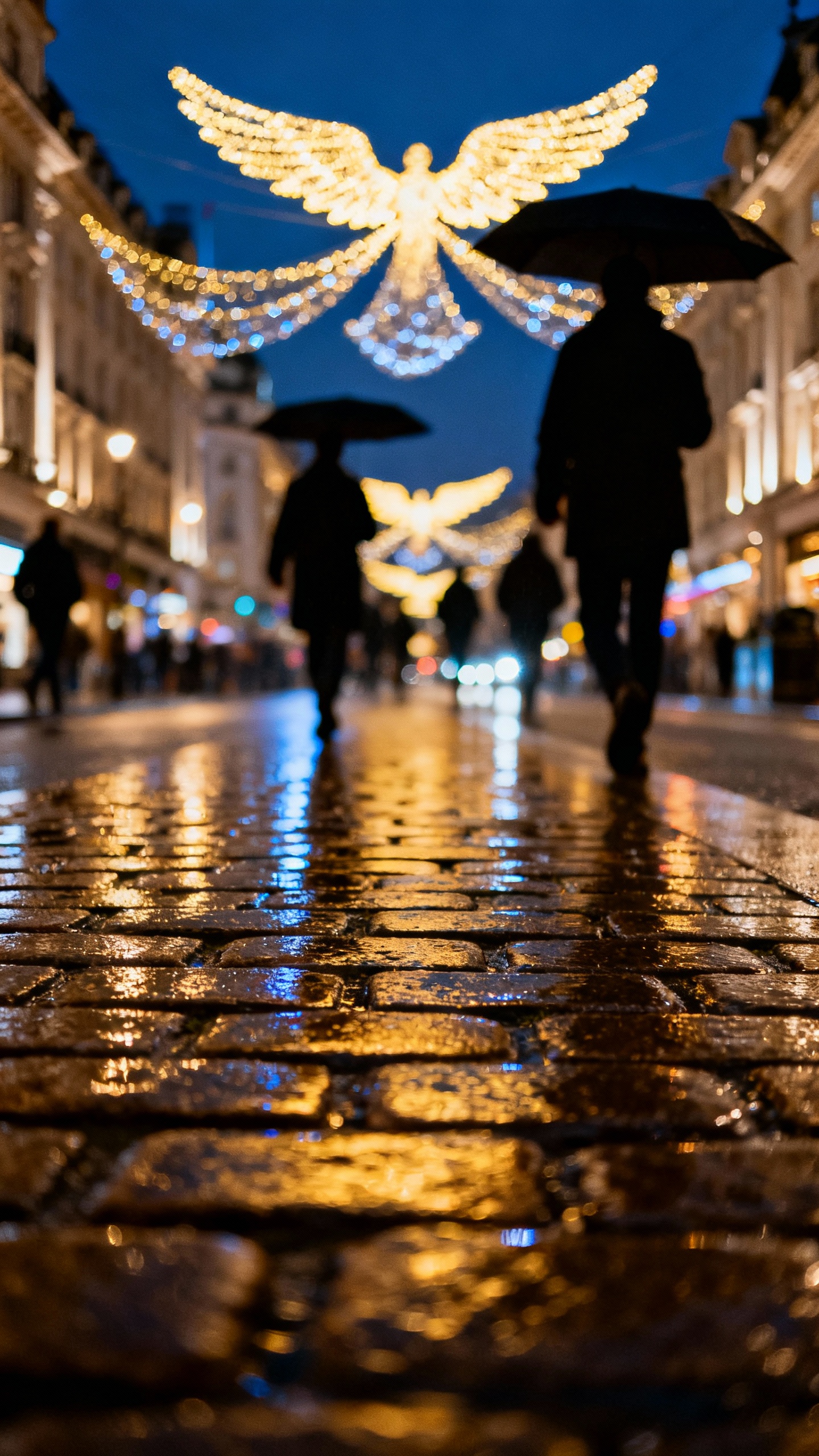Night detail of Regent Street angel lights, wet cobblestones reflecting, umbrella silhouettes
